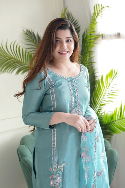 Delicate floral detailing adorns this pastel green embroidered kurta set.