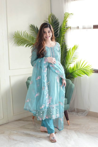 Delicate floral detailing adorns this pastel green embroidered kurta set.